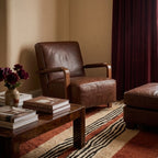 Azar terracotta, ivory and black Beni Ourain rug styled in a refined living room.