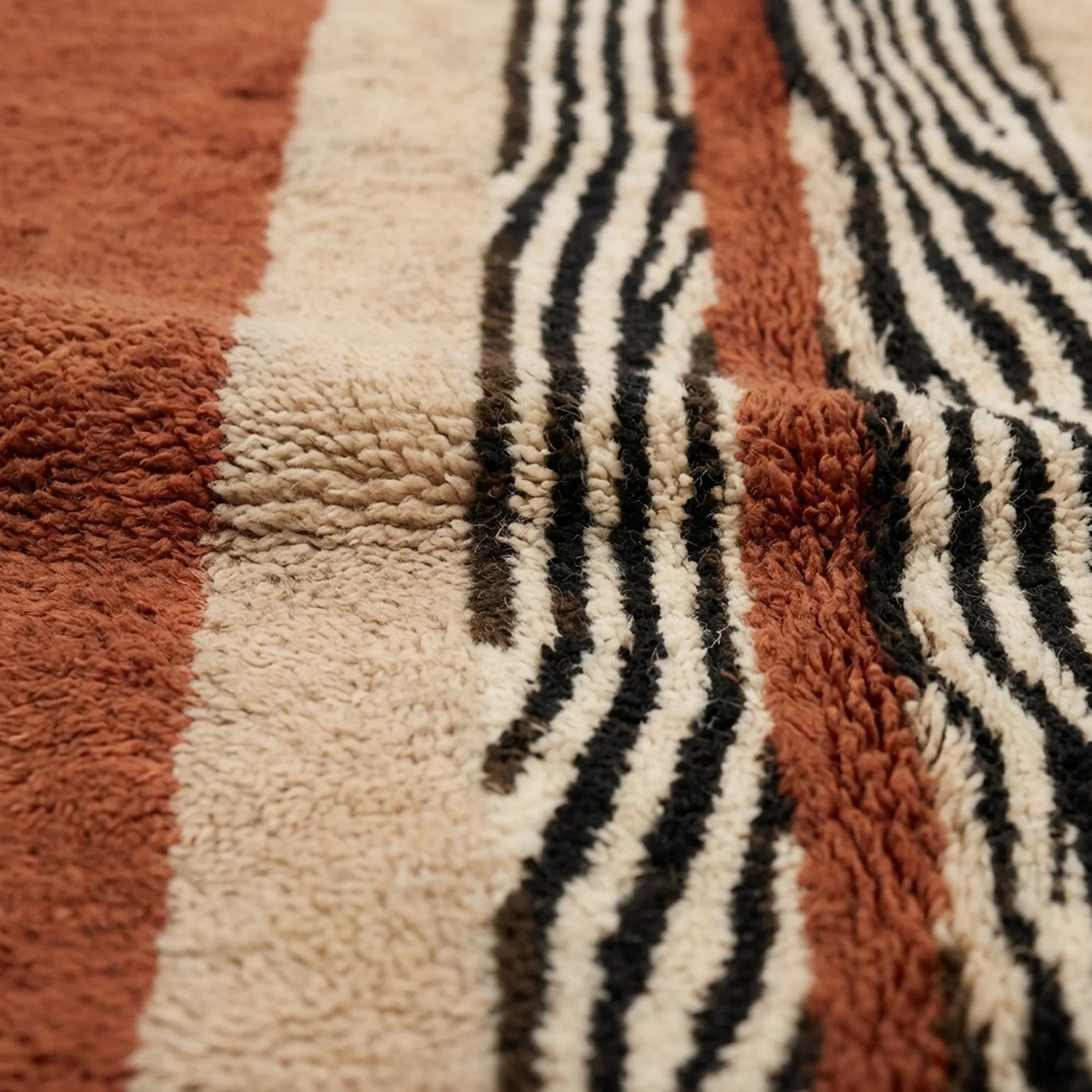 Additional detail of the Azar terracotta, ivory and black Beni Ourain rug.