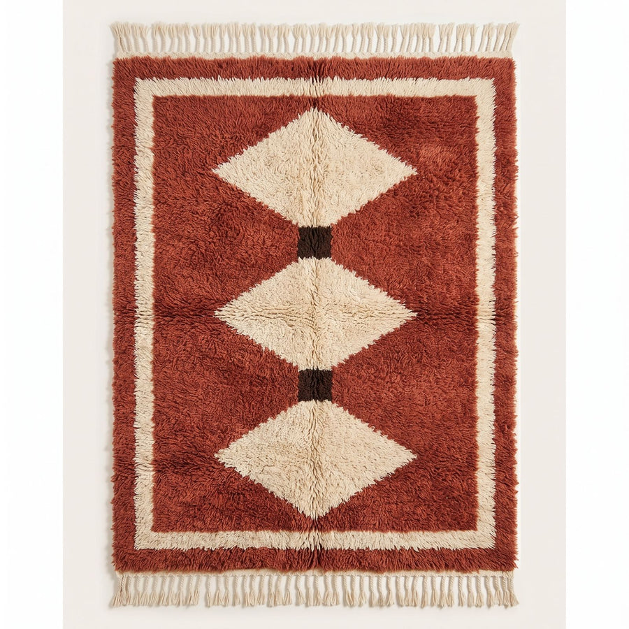 Terracotta and ivory Boujaad rug with three stacked diamond motifs and black separators, plain background