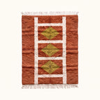Terracotta, ivory and chartreuse Mrirt rug with geometric grid and diamond motifs, flat view