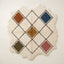 Terracotta, navy, gold, olive and rose Beni Ourain rug with diamond lattice pattern on ivory ground, irregular wavy edges