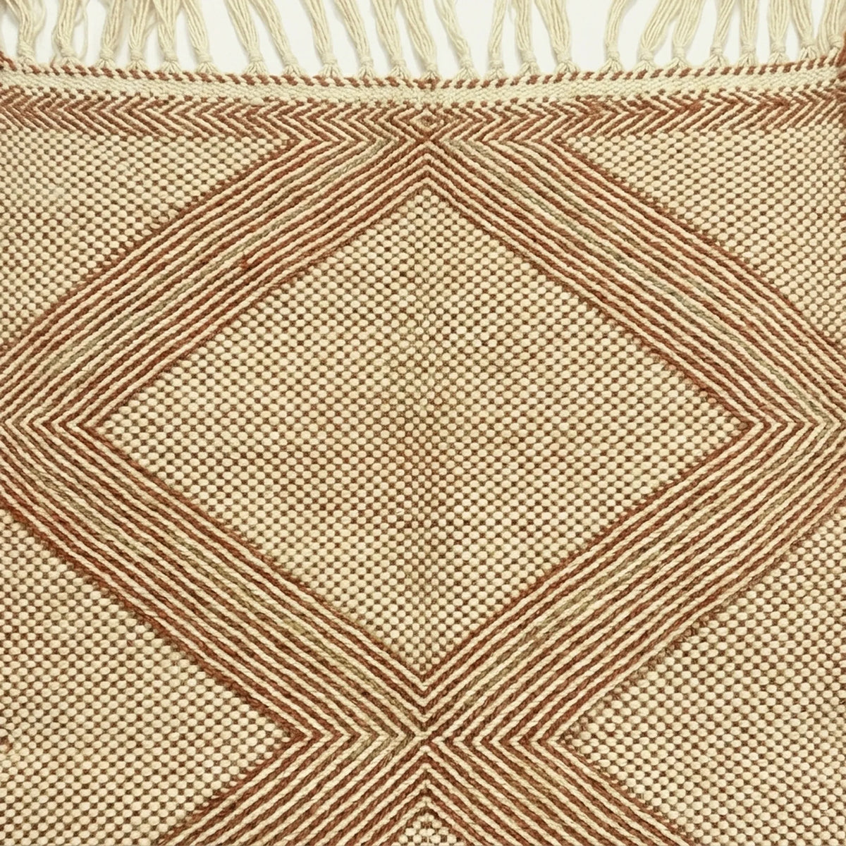 Terracotta and ivory Zanafi kilim rug Tiziriq with diamond medallions, flat-weave texture detail
