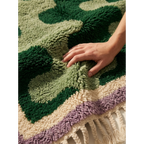 Fringe corner of the Tifawt Beni Ourain rug with green, ivory and lavender wool.