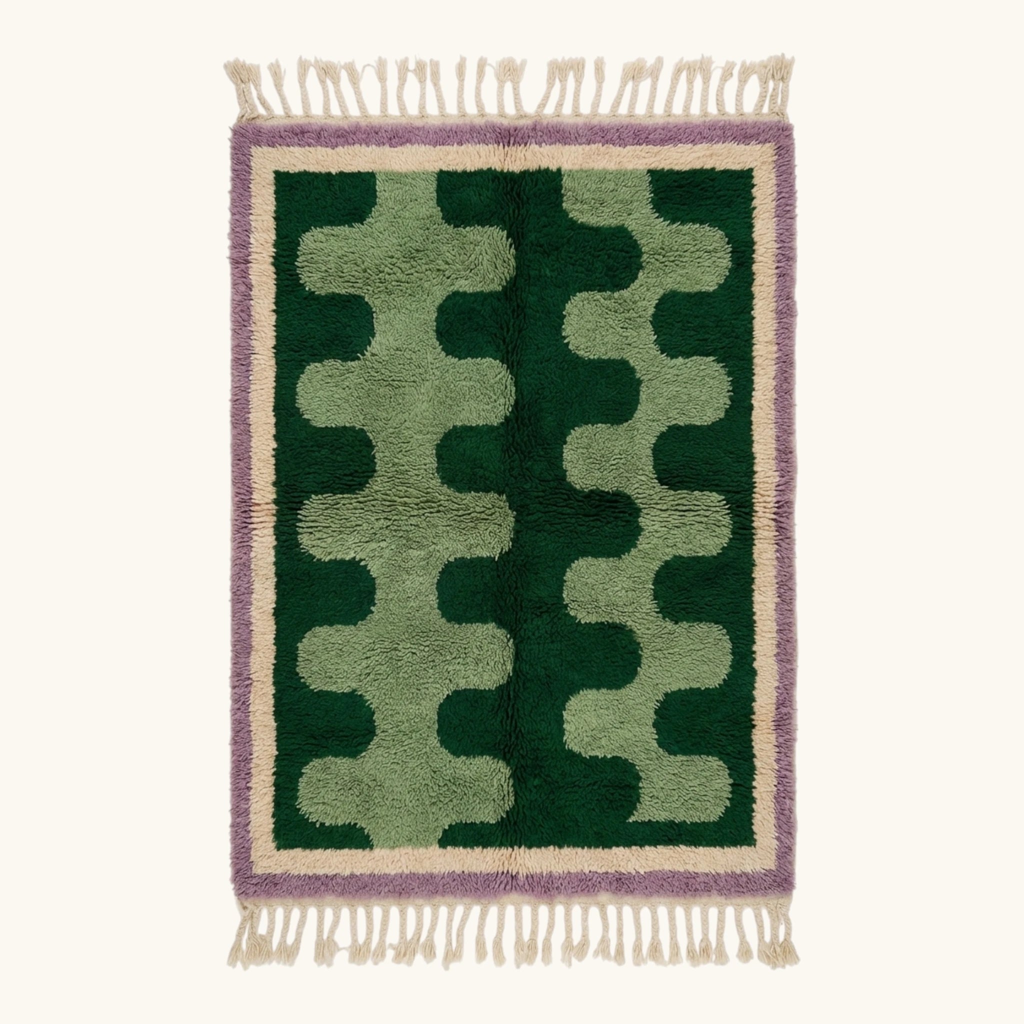 Full view of the Tifawt Beni Ourain rug with forest-green and sage abstract forms, an ivory border and lavender trim.