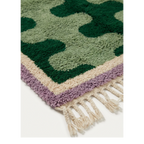 Tifawt green abstract Beni Ourain rug styled in a contemporary living room.