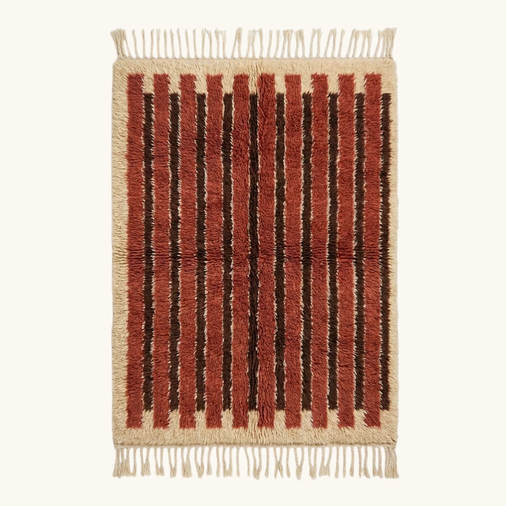 Full view of the Tifrit terracotta Beni Ourain rug with linear stripes and hand-tied fringe.