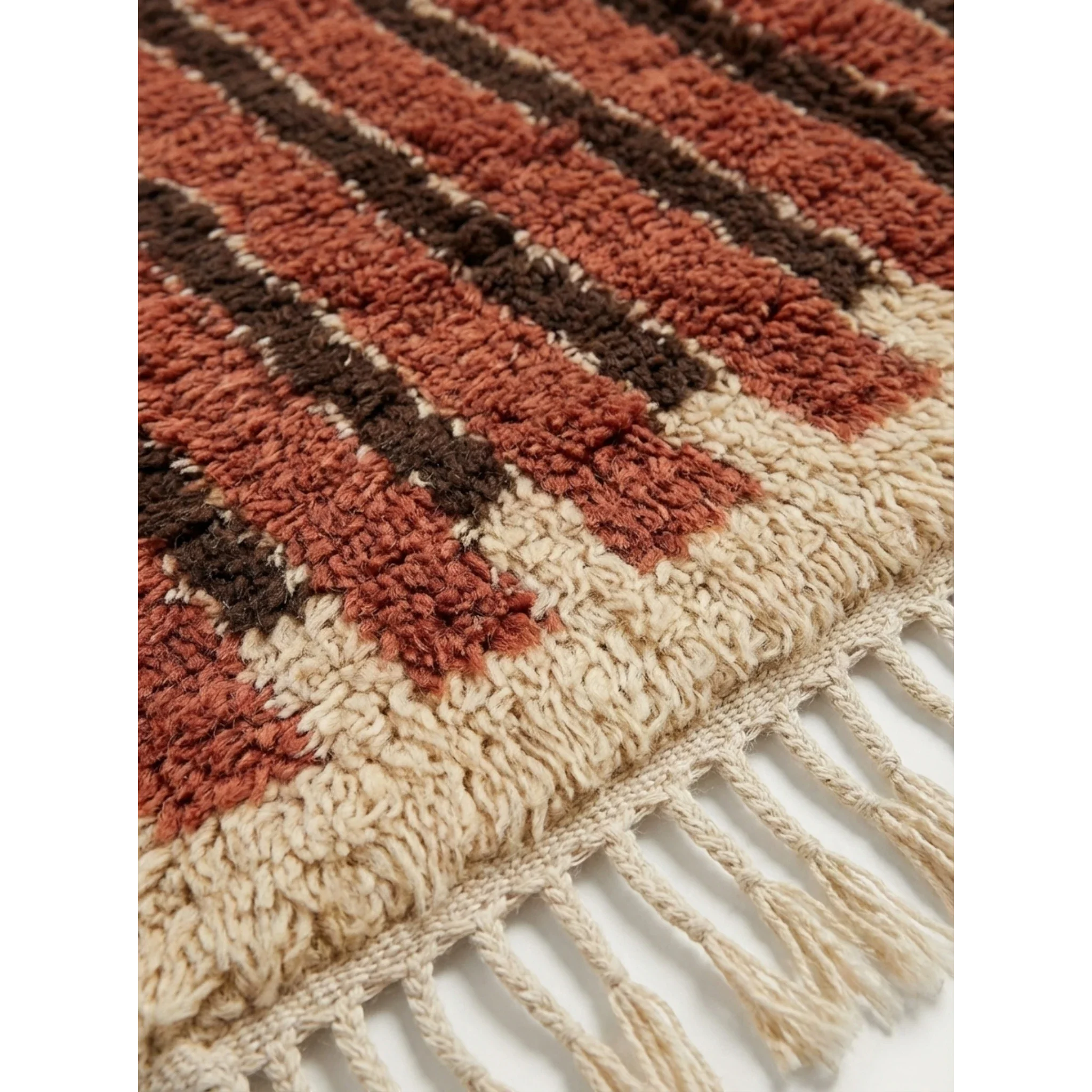Close-up of the terracotta and ivory linear pattern on the Tifrit Beni Ourain rug.