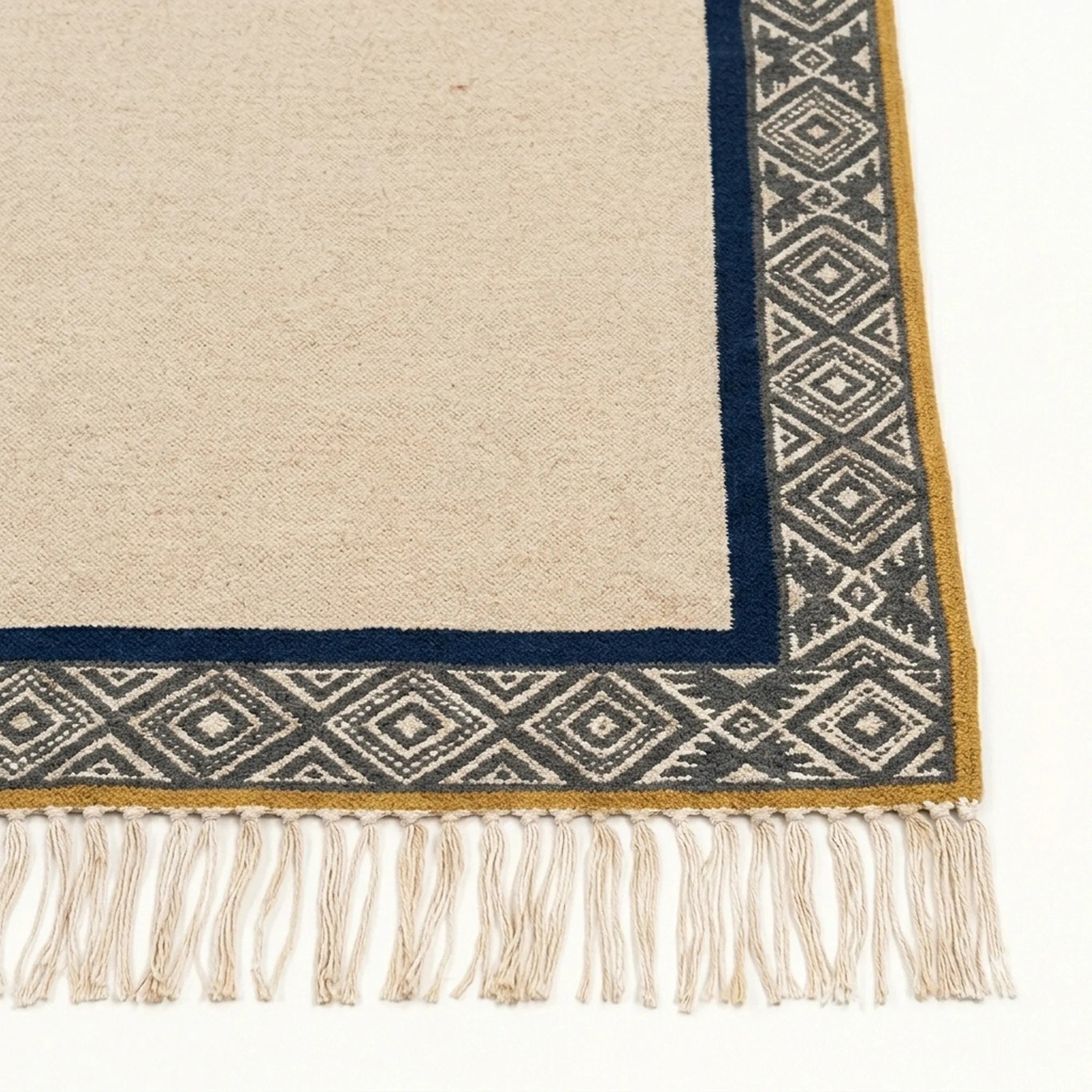 Ivory, charcoal and navy Zanafi rug Tighremt with tribal geometric border, border and fringe detail