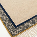 Ivory, charcoal and navy Zanafi rug Tighremt with tribal geometric border, weave and fringe detail