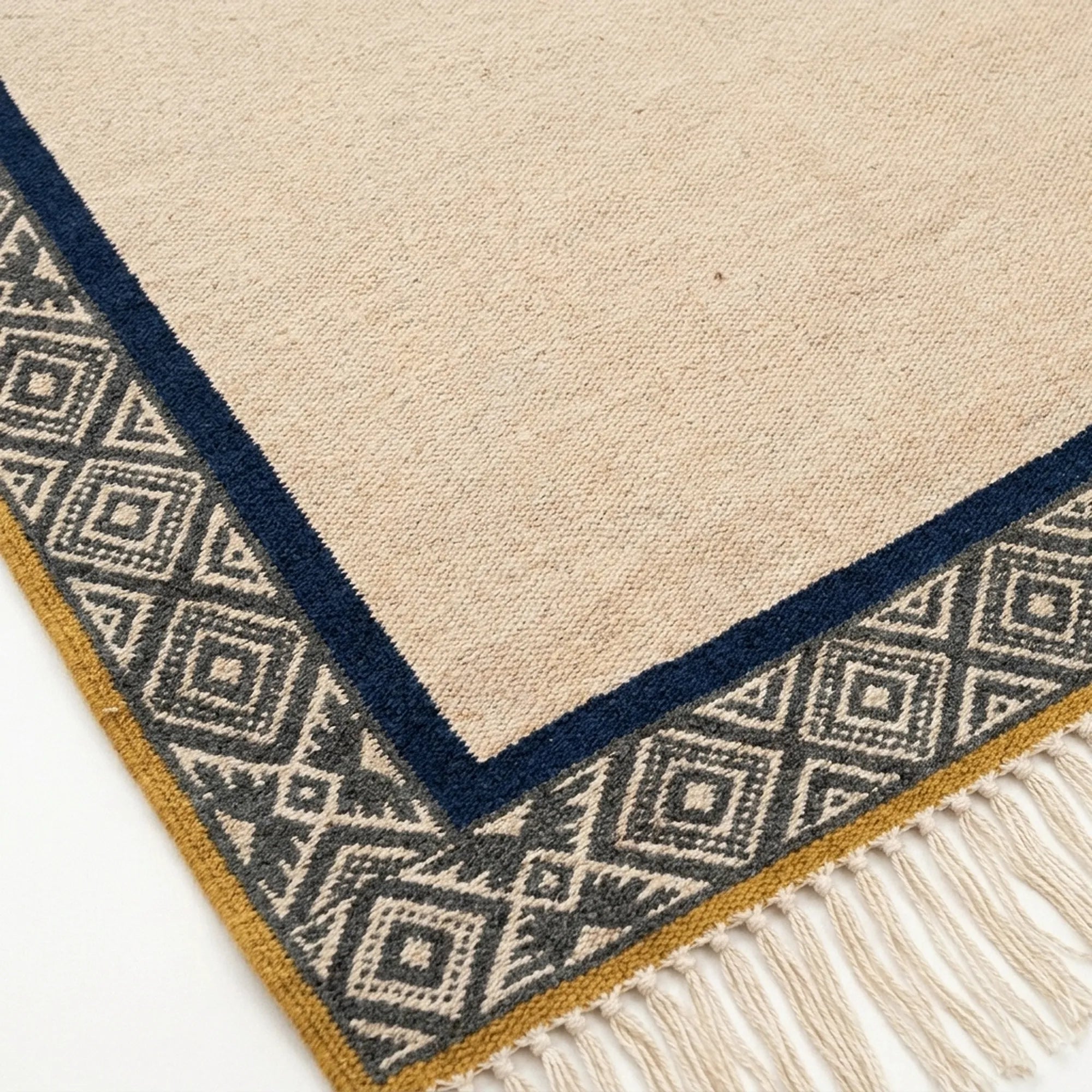 Ivory, charcoal and navy Zanafi rug Tighremt with tribal geometric border, weave and fringe detail