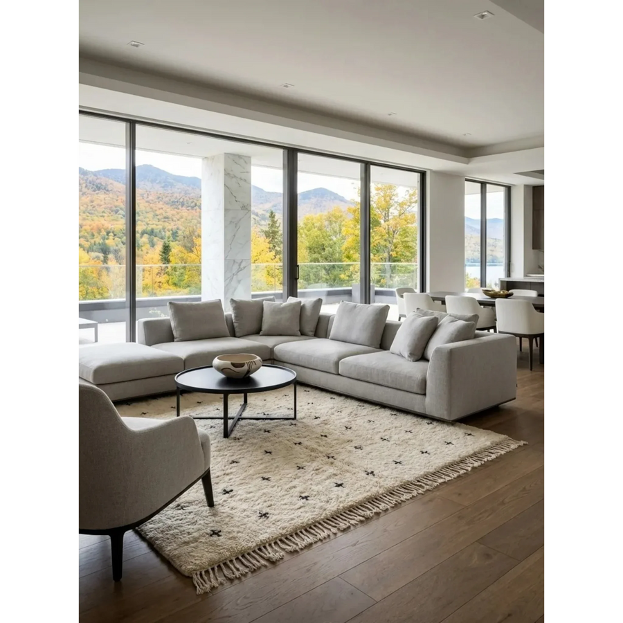 Tislit ivory Beni Ourain rug styled in a bright contemporary living room.