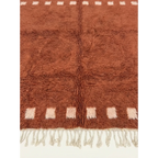 Hand-tied fringe and plush Atlas wool detail of the Tiziri terracotta rug.