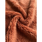 Soft terracotta and ivory wool texture detail of the Tiziri Moroccan rug.