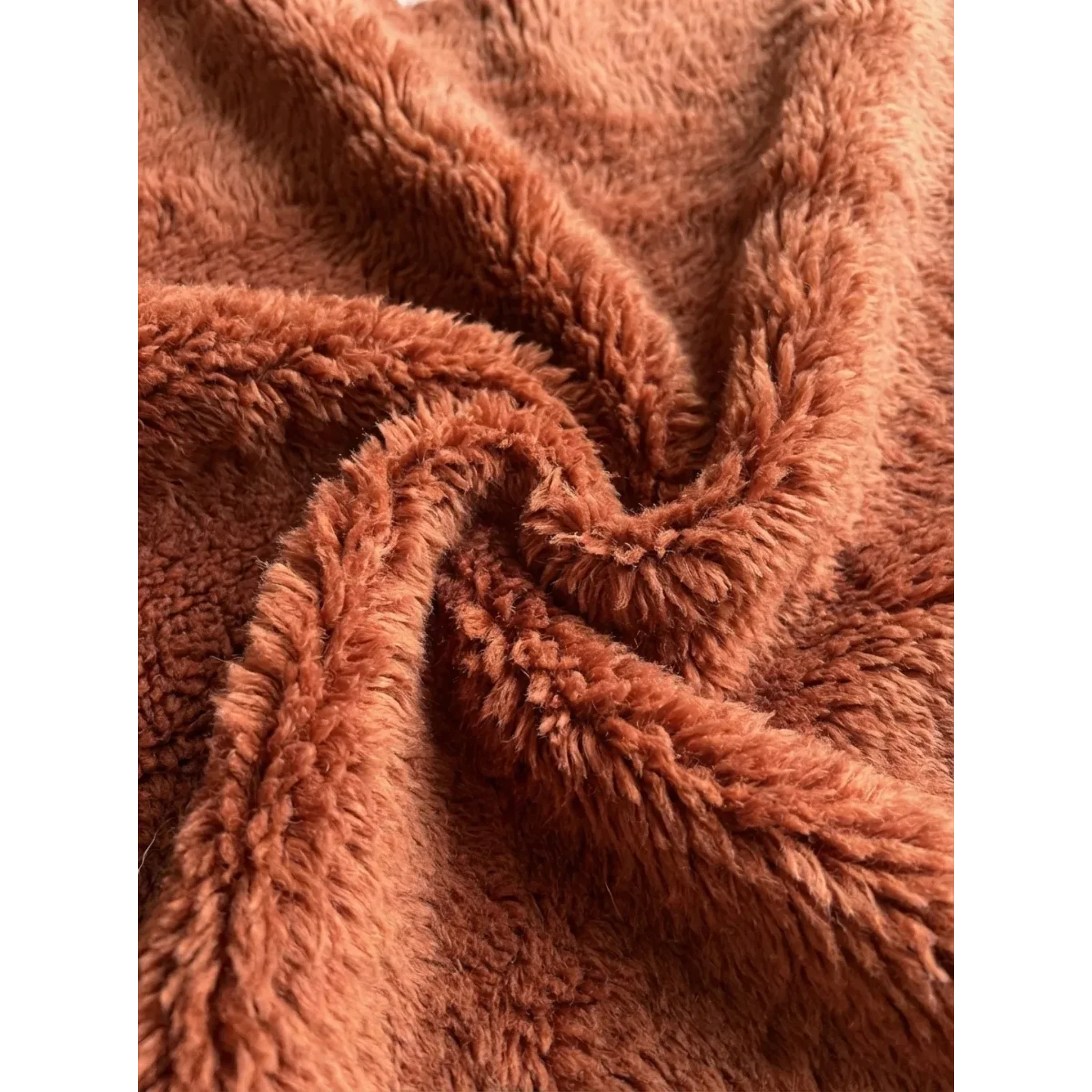Soft terracotta and ivory wool texture detail of the Tiziri Moroccan rug.