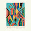Full view of the Anir turquoise, coral and yellow Boujaad rug with a wavy geometric diamond design.