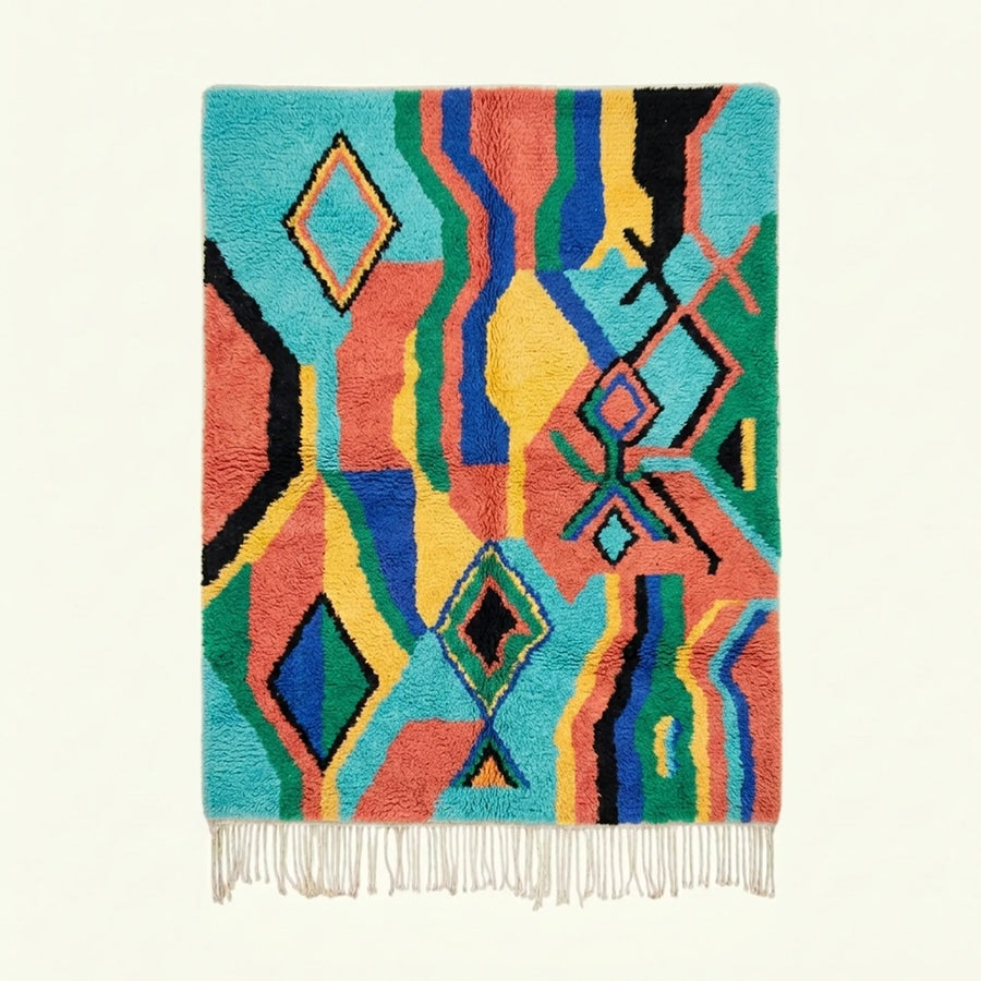 Full view of the Anir turquoise, coral and yellow Boujaad rug with a wavy geometric diamond design.