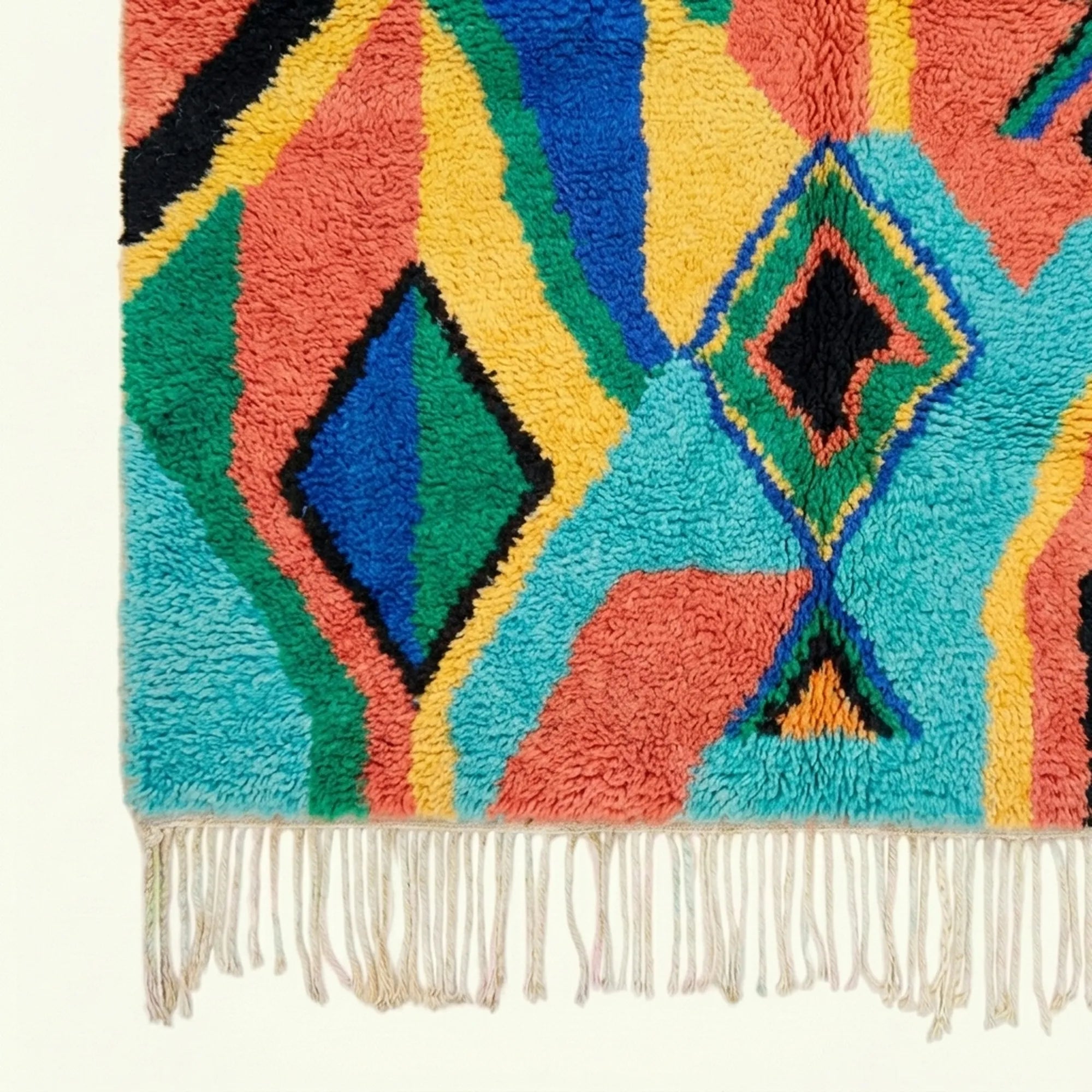 Fringe and edge detail of the Anir turquoise Boujaad rug.