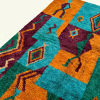 Close-up of the geometric symbol patchwork design on the Azru Boujaad rug.