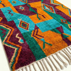 Close-up of the natural wool pile and woven texture of the Azru Boujaad rug.