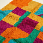 Angled view showing the pattern and wool pile of the Itri Boujaad rug.
