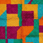Close-up of the checkerboard color-block design on the Itri Boujaad rug.