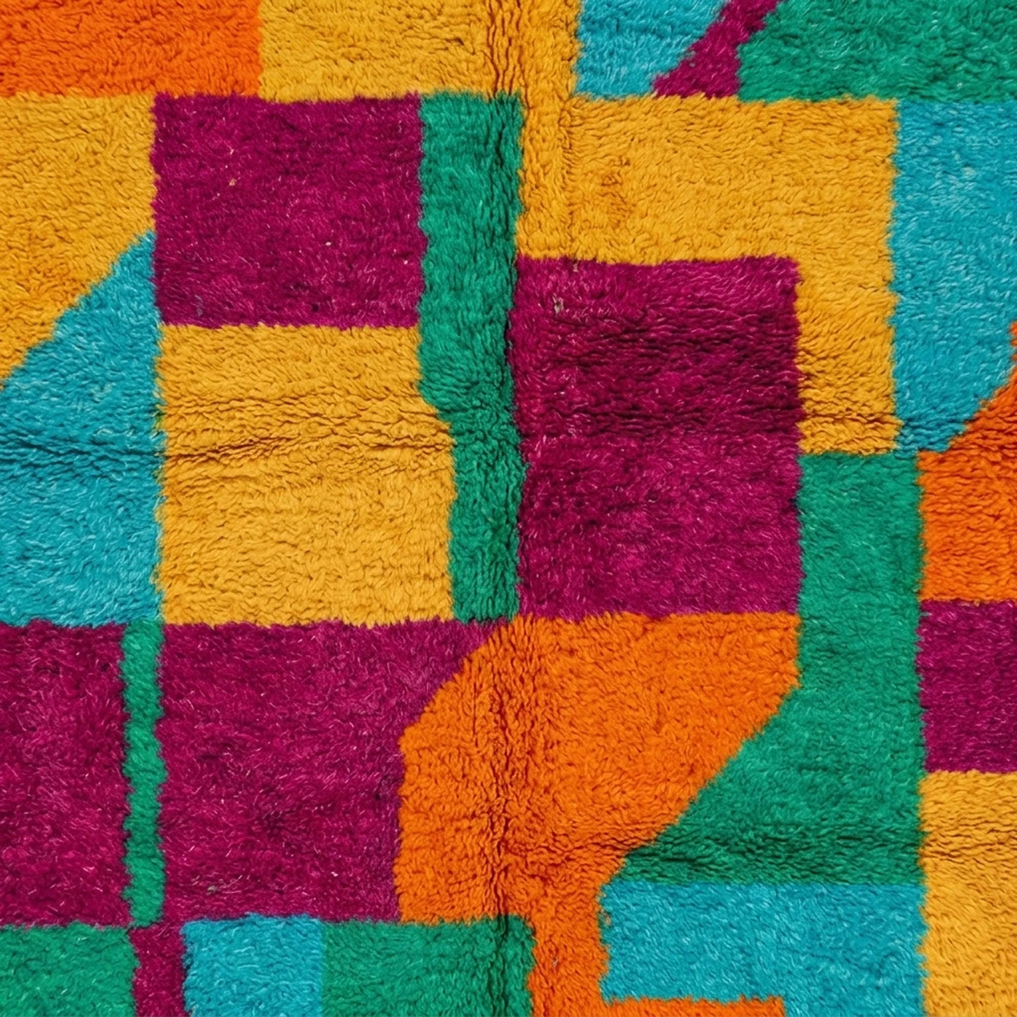 Close-up of the checkerboard color-block design on the Itri Boujaad rug.
